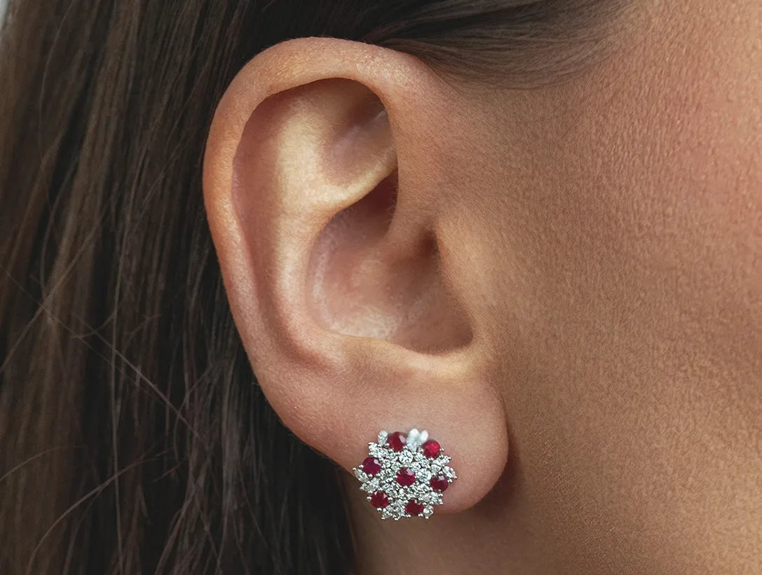 Diamond and ruby stud earrings styled for elegant occasions