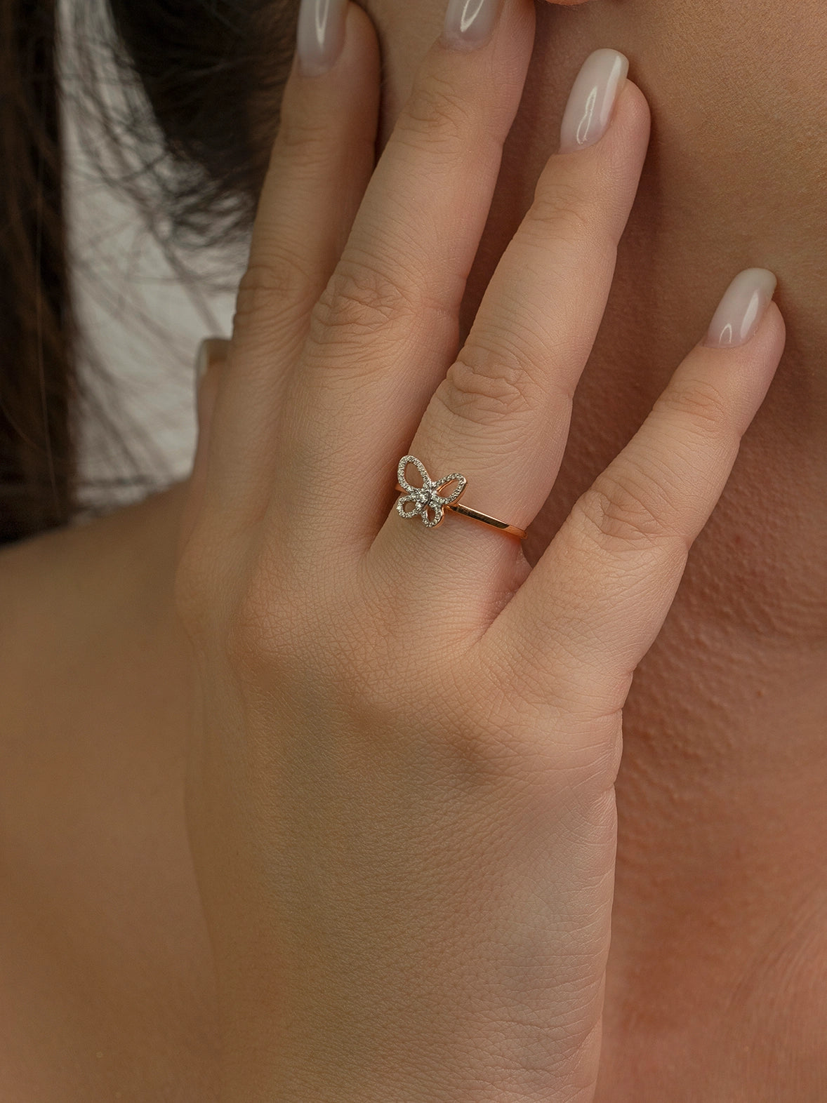 Gold and diamond ring on hand